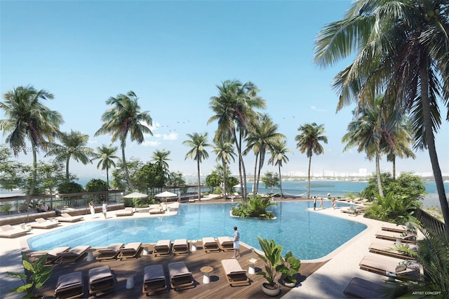 view of pool with a water view and a patio