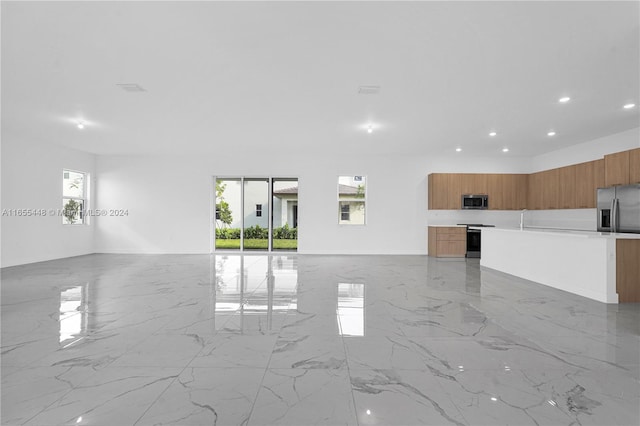 12267 SW 43rd Ct, Davie, FL 33330 - unfurnished living room with light marble finish floors and recessed lighting