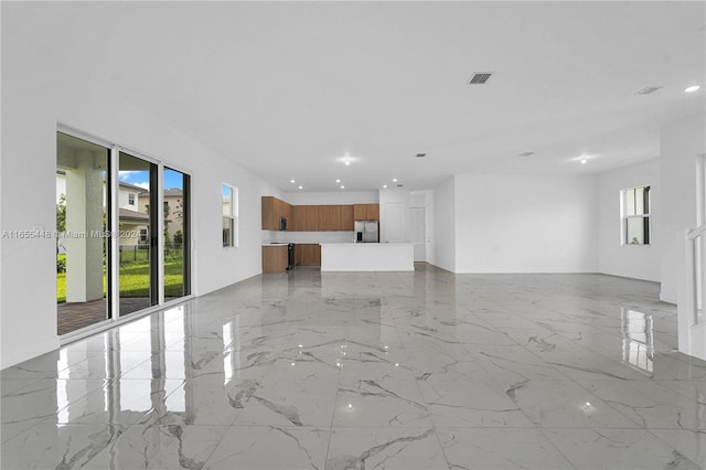 12267 SW 43rd Ct, Davie, FL 33330 - unfurnished living room with recessed lighting and light marble finish flooring