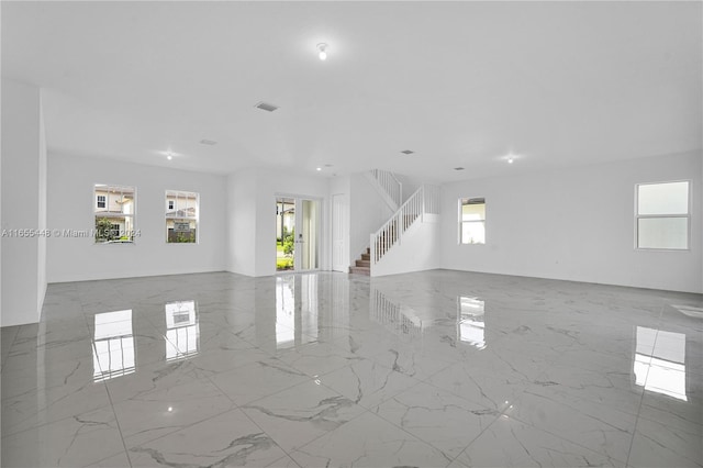 12267 SW 43rd Ct, Davie, FL 33330 - spare room with stairs, healthy amount of natural light, and marble tiled flooring