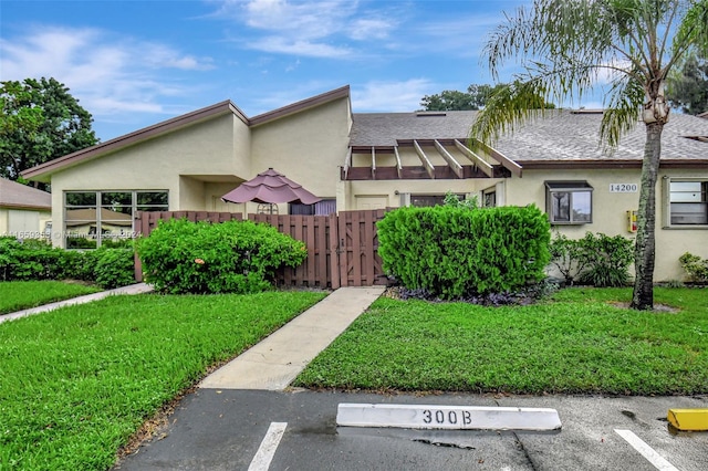 view of side of home with a lawn