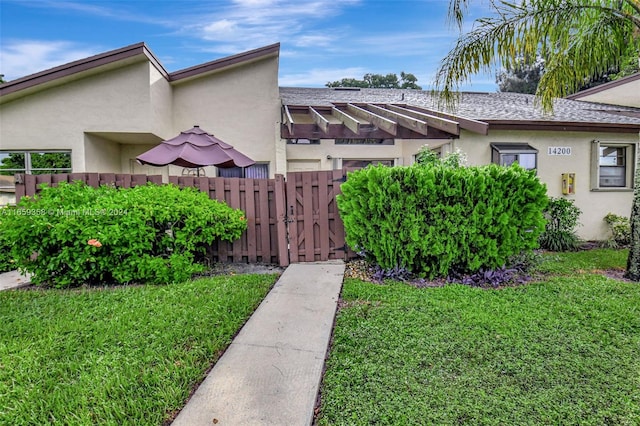 view of side of property with a yard