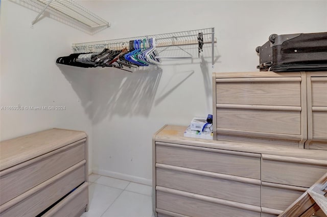 spacious closet featuring light tile patterned floors