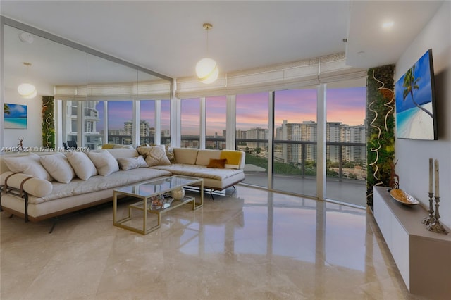 living room featuring a wall of windows