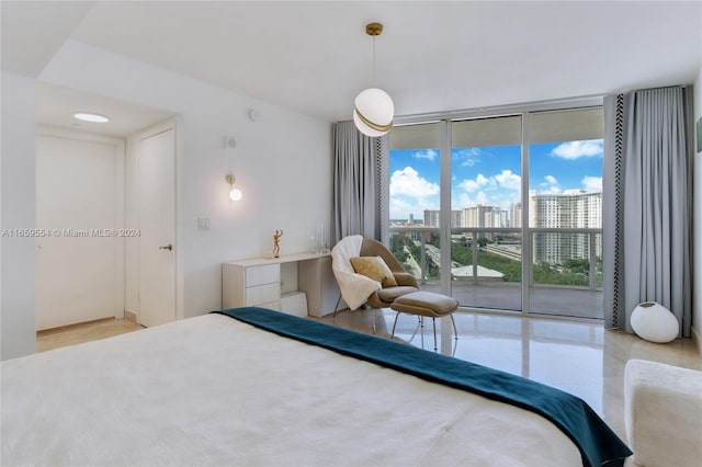 bedroom with access to outside and expansive windows