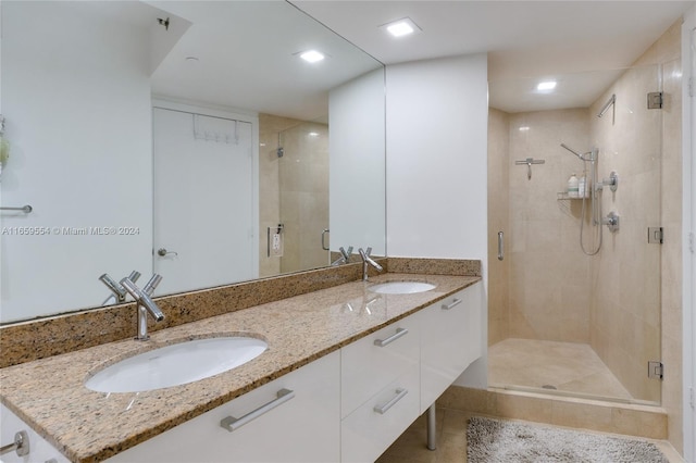 bathroom with walk in shower and vanity