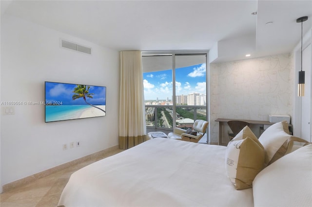 tiled bedroom featuring floor to ceiling windows and access to exterior