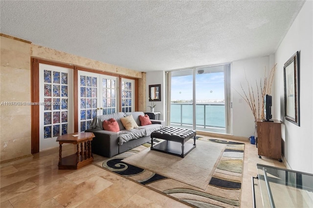living area featuring a textured ceiling