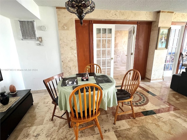 dining area with a textured ceiling