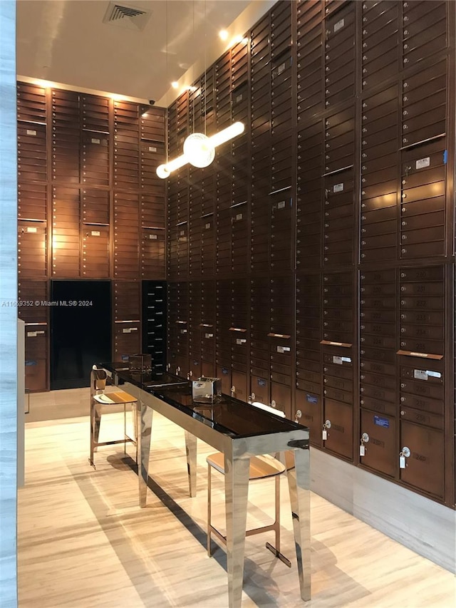 wine cellar with light hardwood / wood-style flooring