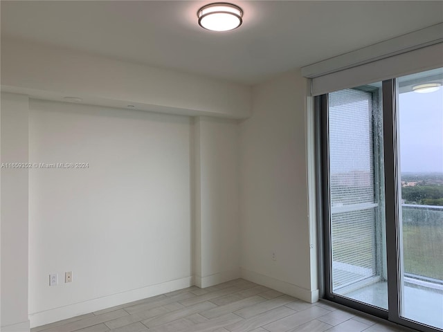 unfurnished room featuring light hardwood / wood-style floors