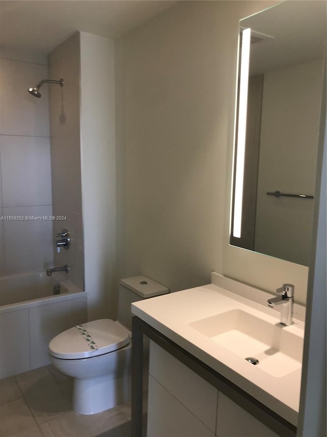 full bathroom featuring tile patterned flooring, vanity, toilet, and bathtub / shower combination