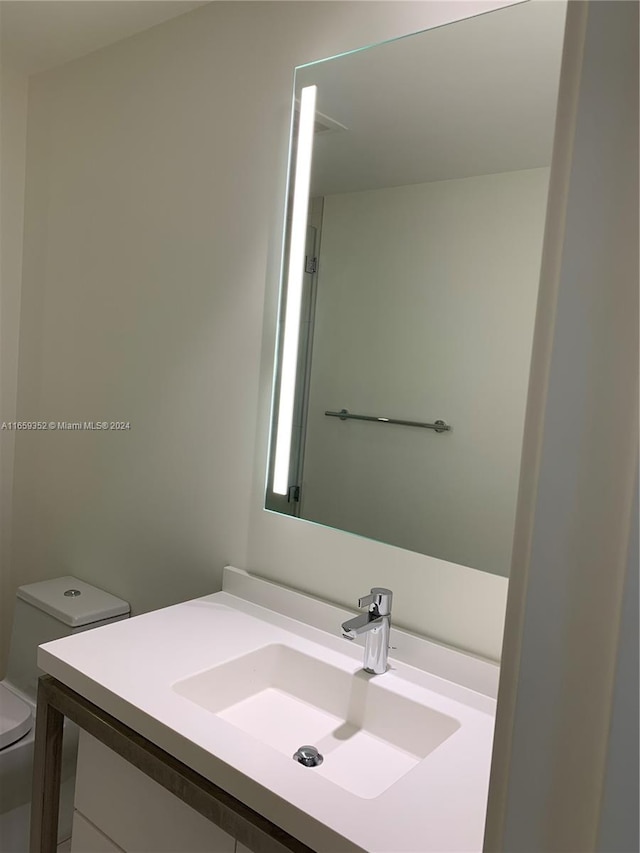 bathroom with vanity and toilet