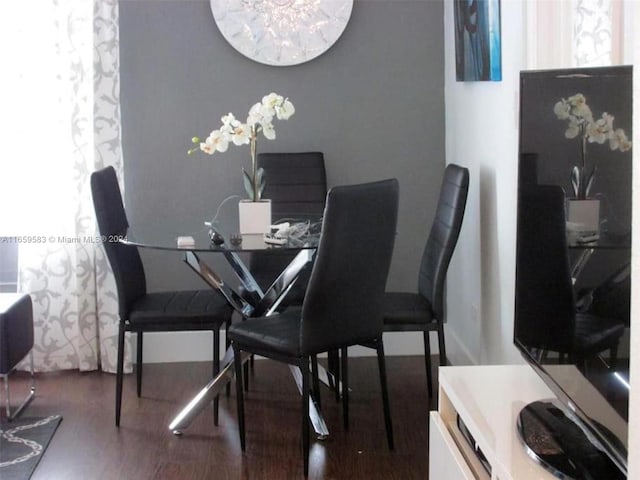 dining room featuring dark hardwood / wood-style flooring