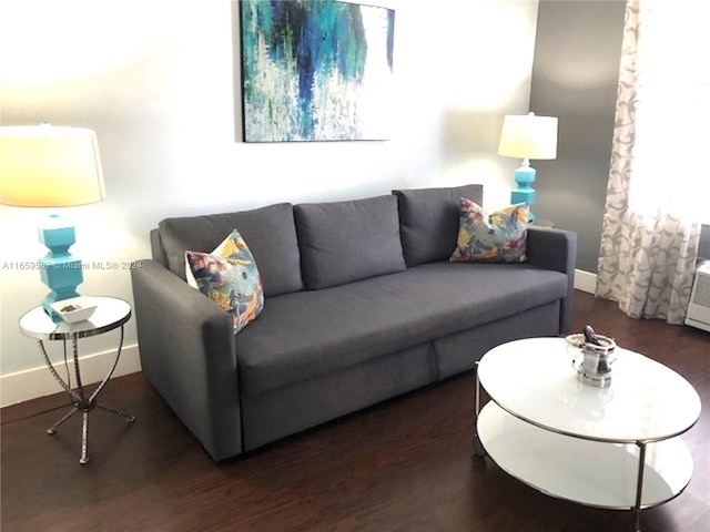 living room with dark hardwood / wood-style floors