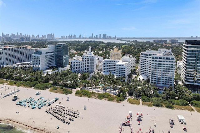 bird's eye view featuring a water view and a view of the beach