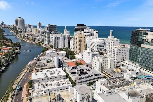 birds eye view of property featuring a water view