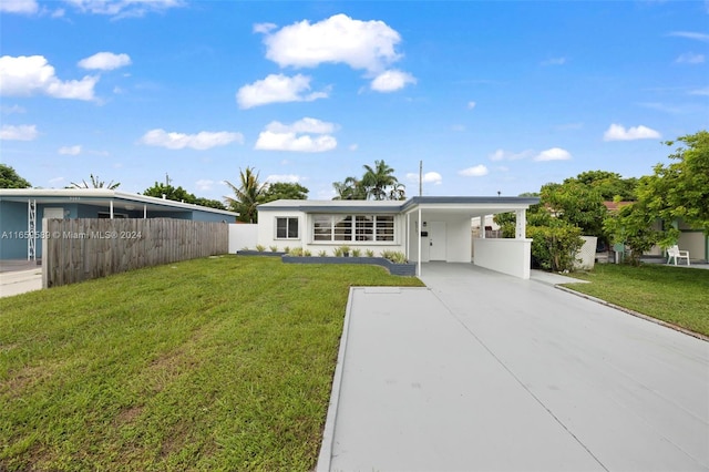 ranch-style house with a front lawn and a carport