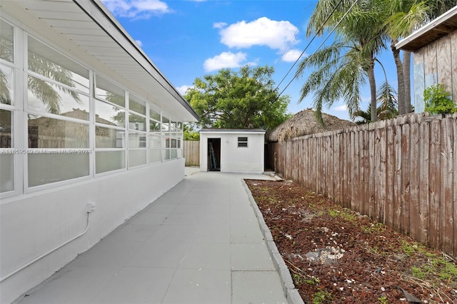 view of patio / terrace with an outbuilding