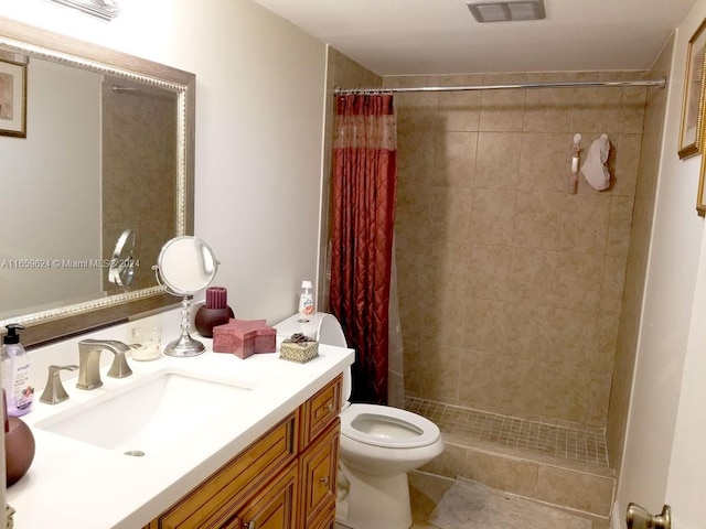 bathroom with vanity, toilet, a shower with curtain, and tile patterned floors