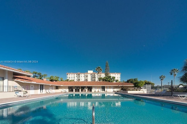 view of swimming pool featuring a patio area