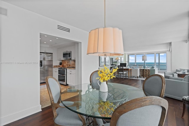2200 S Ocean Ln Unit 702, Fort Lauderdale, FL 33316 - dining area with visible vents, recessed lighting, baseboards, and wood finished floors