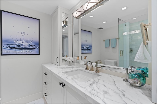 bathroom with an enclosed shower, toilet, and vanity