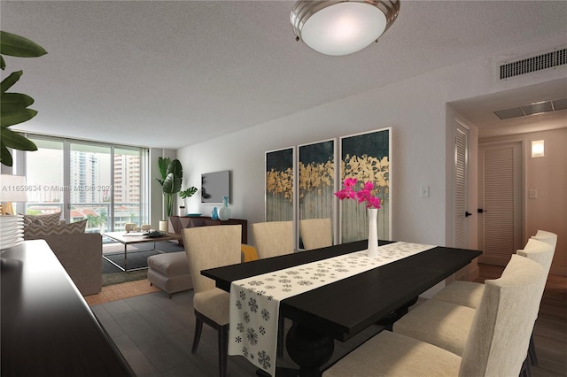 dining room featuring a textured ceiling, dark hardwood / wood-style floors, and expansive windows