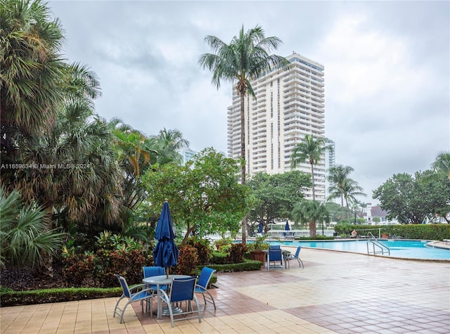 view of patio featuring a community pool