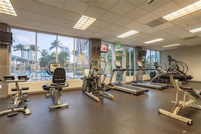 exercise room featuring a drop ceiling