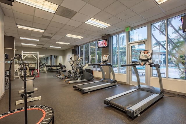 exercise room with a paneled ceiling