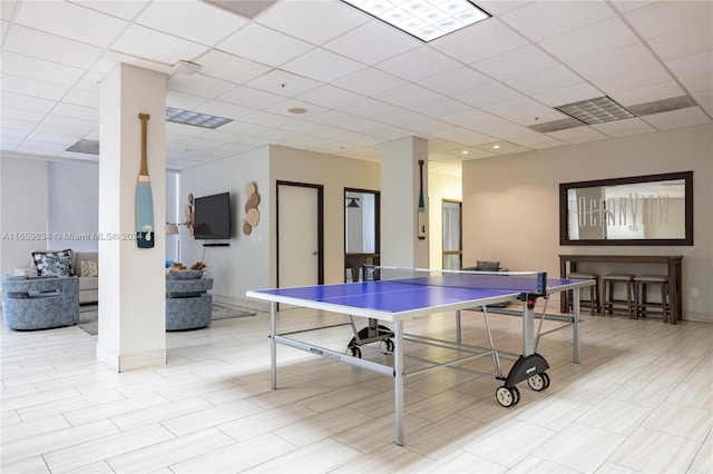 recreation room with a drop ceiling