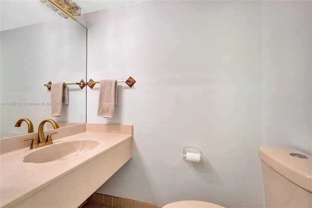 full bathroom featuring toilet,  shower combination, a textured ceiling, vanity, and tile patterned flooring