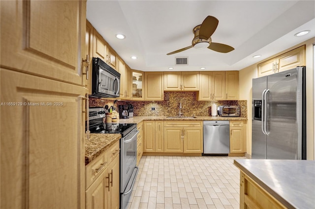 kitchen with sink, ceiling fan, stainless steel appliances, tasteful backsplash, and light brown cabinets