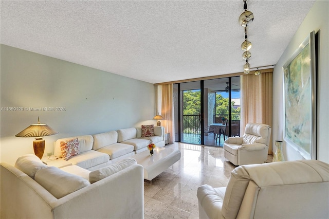 living room with a wall of windows and a textured ceiling