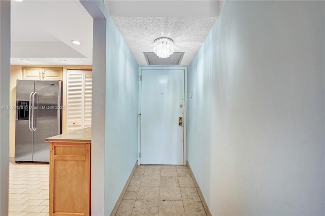 hallway featuring a textured ceiling