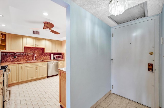 kitchen featuring sink, ceiling fan, appliances with stainless steel finishes, tasteful backsplash, and light brown cabinetry