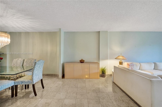 dining space featuring a textured ceiling