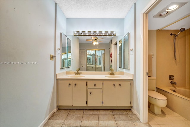 full bathroom featuring toilet, a textured ceiling, shower / washtub combination, ceiling fan, and tile patterned flooring