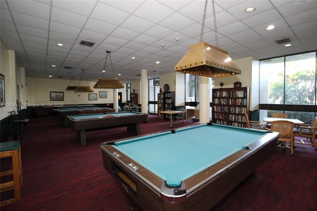 playroom featuring expansive windows, pool table, and a drop ceiling