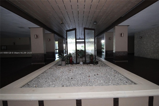 hall featuring wood ceiling