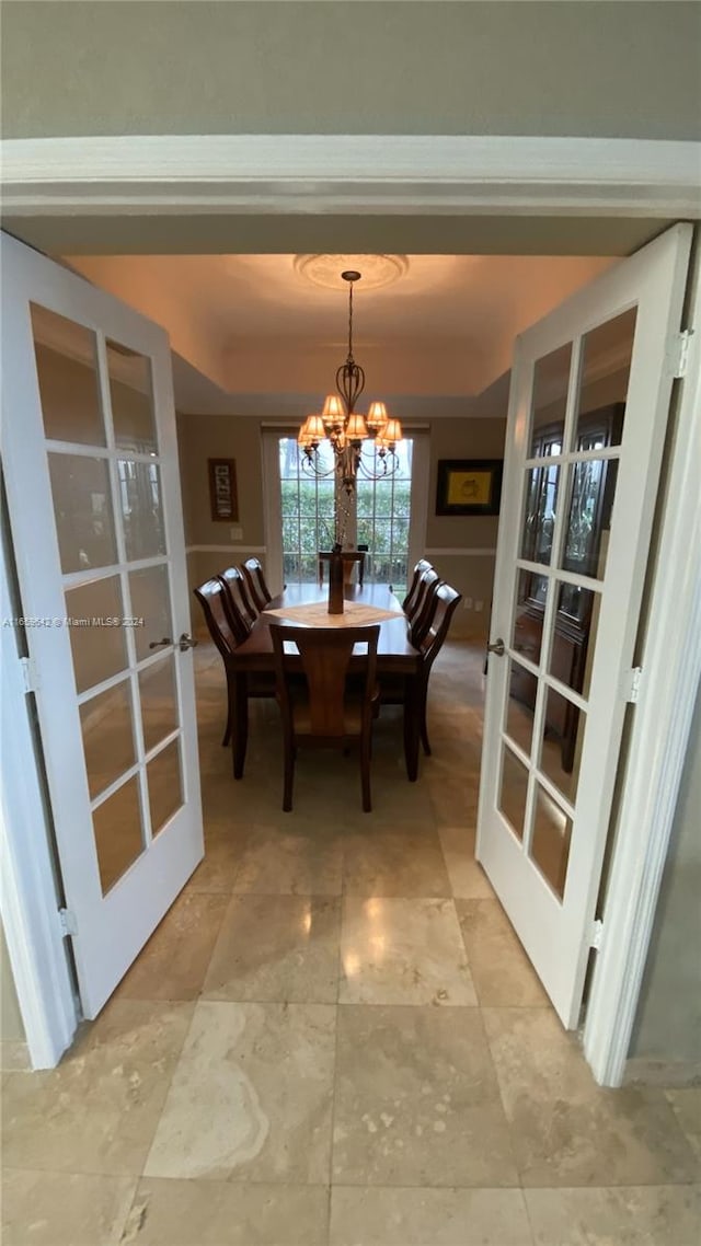 dining area featuring a notable chandelier