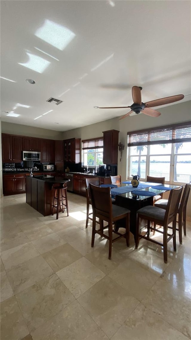 dining space with ceiling fan