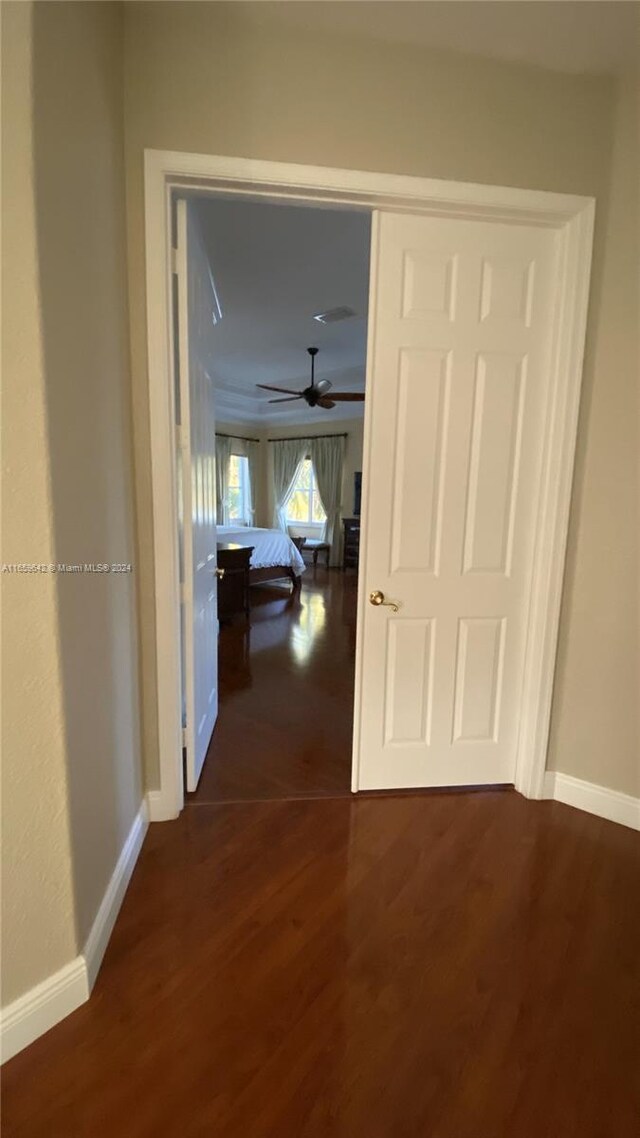 hallway featuring dark wood-type flooring