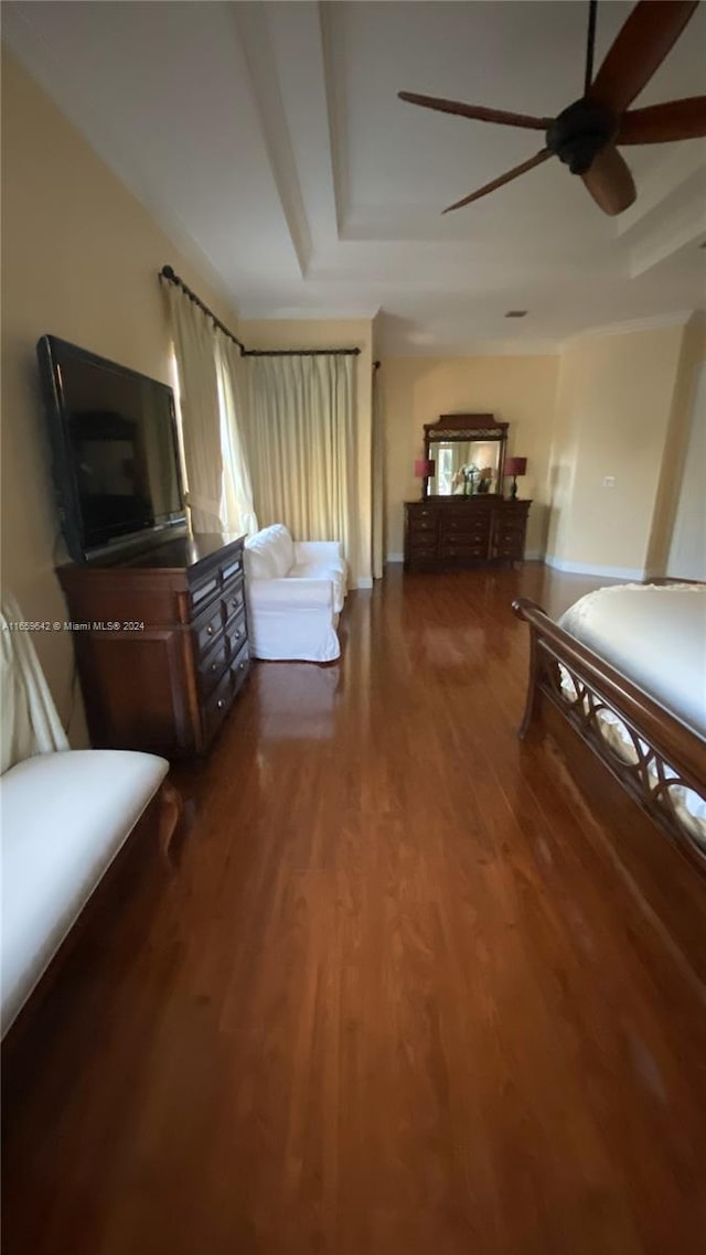 bedroom with dark wood-type flooring and ceiling fan