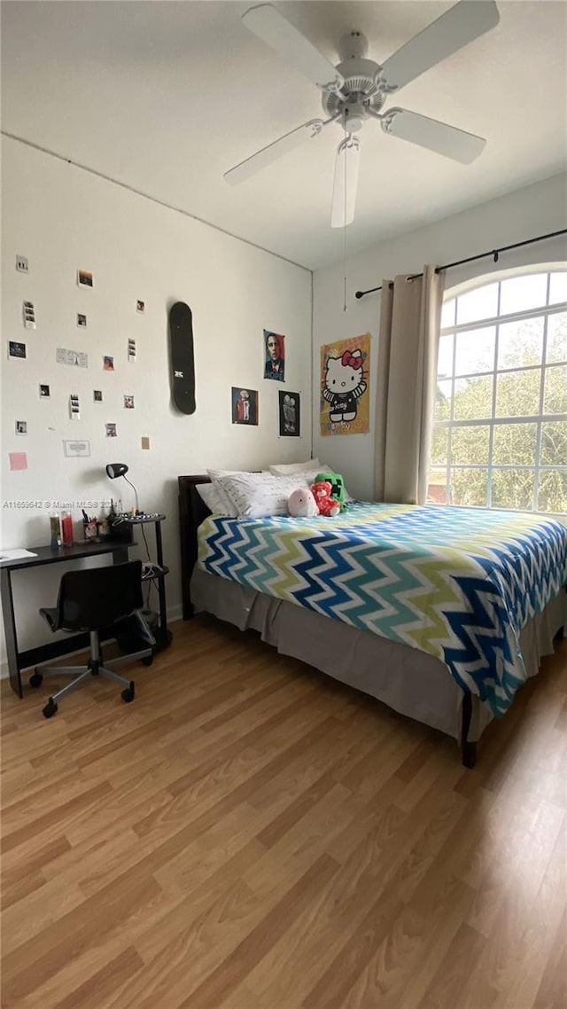 bedroom featuring ceiling fan and hardwood / wood-style floors