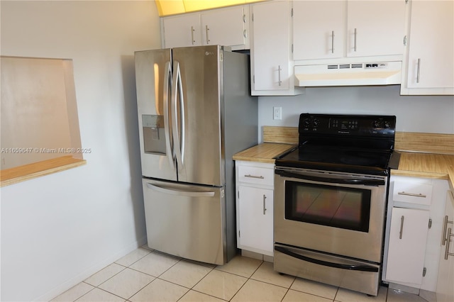 kitchen featuring light tile patterned floors, under cabinet range hood, stainless steel appliances, white cabinetry, and light countertops