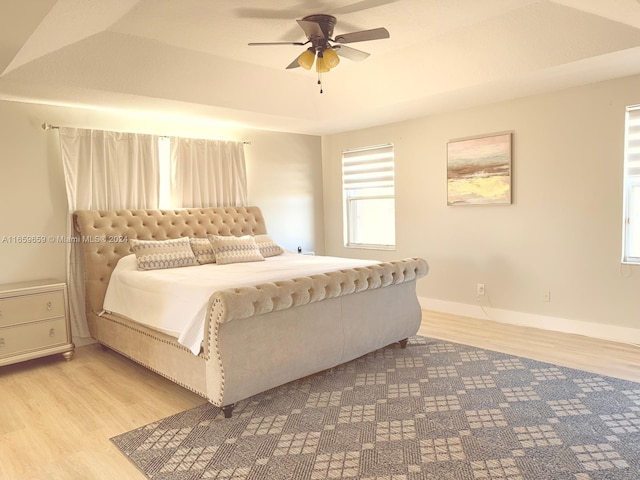 bedroom featuring ceiling fan and light hardwood / wood-style flooring