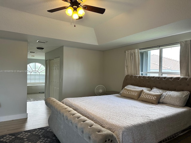 bedroom featuring hardwood / wood-style floors, a closet, and ceiling fan