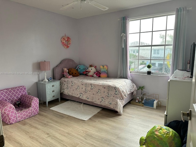 bedroom featuring ceiling fan and light hardwood / wood-style floors